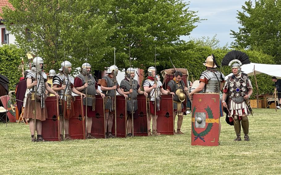 Reenactors dressed in Roman Empire attire as legionnaires